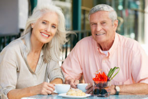 Dental Implant Patients Eating Together With Their False Teeth in Albuquerque, NM